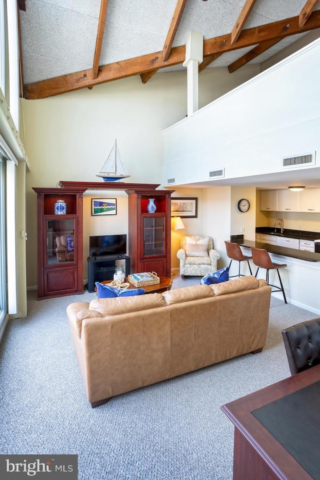312 Severn Ave Unit W 401, Annapolis, MD 21403 - living room featuring carpet flooring, high vaulted ceiling, and beam ceiling