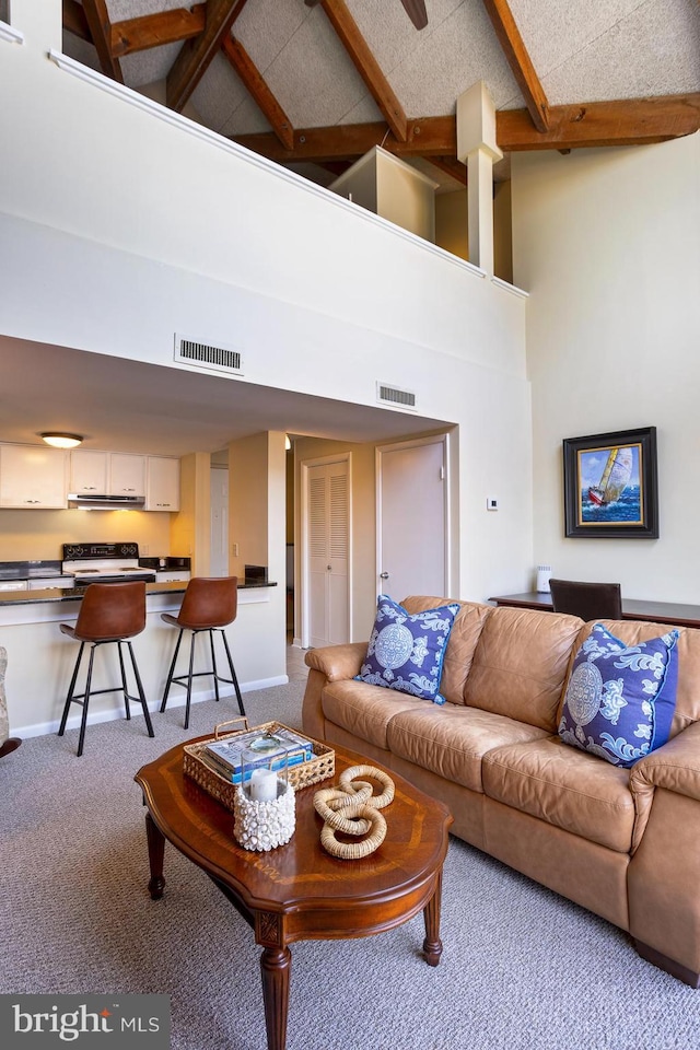 312 Severn Ave Unit W 401, Annapolis, MD 21403 - living room featuring a towering ceiling, carpet flooring, and beamed ceiling