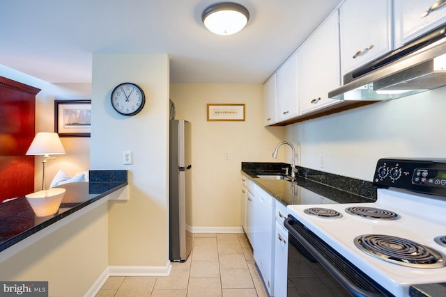 312 Severn Ave Unit W 401, Annapolis, MD 21403 - kitchen with range with electric cooktop, freestanding refrigerator, under cabinet range hood, white cabinets, and light tile patterned floors