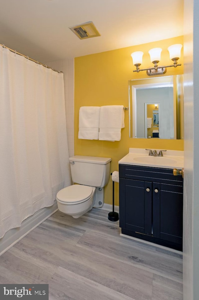 312 Severn Ave Unit W 401, Annapolis, MD 21403 - bathroom featuring wood finished floors, vanity, and shower / bath combination with curtain