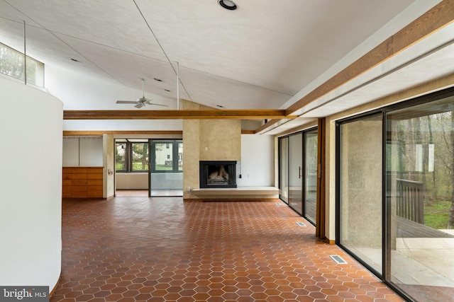 390 S Bryn Mawr Ave, Bryn Mawr, PA 19010 - unfurnished living room featuring a large fireplace, visible vents, ceiling fan, and lofted ceiling