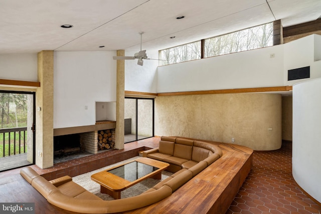 390 S Bryn Mawr Ave, Bryn Mawr, PA 19010 - living room featuring a fireplace, a high ceiling, and a ceiling fan