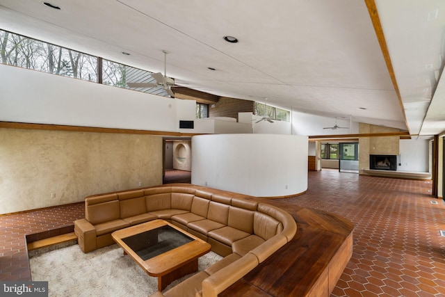 390 S Bryn Mawr Ave, Bryn Mawr, PA 19010 - sunken living room with recessed lighting, a tiled fireplace, high vaulted ceiling, and a ceiling fan