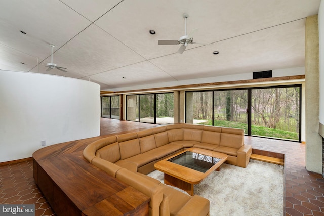 390 S Bryn Mawr Ave, Bryn Mawr, PA 19010 - living room with tile patterned floors, a ceiling fan, and a wealth of natural light
