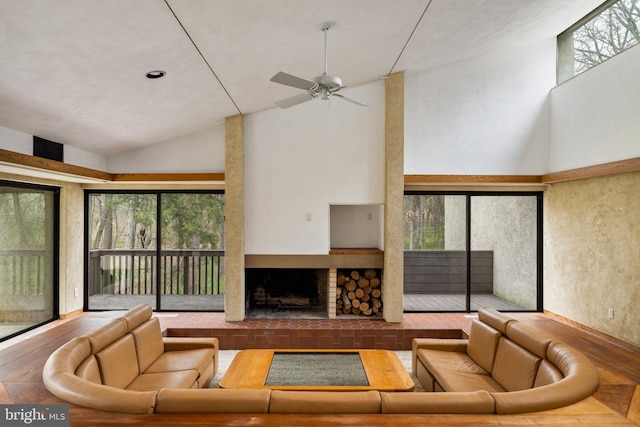 390 S Bryn Mawr Ave, Bryn Mawr, PA 19010 - living room featuring high vaulted ceiling, a ceiling fan, and a fireplace