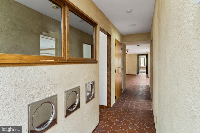 390 S Bryn Mawr Ave, Bryn Mawr, PA 19010 - hallway featuring dark tile patterned floors and a textured wall