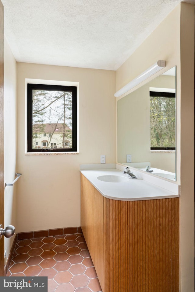 390 S Bryn Mawr Ave, Bryn Mawr, PA 19010 - bathroom featuring tile patterned flooring, vanity, and a healthy amount of sunlight