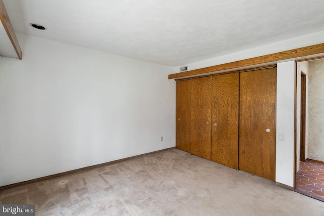 390 S Bryn Mawr Ave, Bryn Mawr, PA 19010 - unfurnished bedroom featuring a closet, baseboards, and carpet