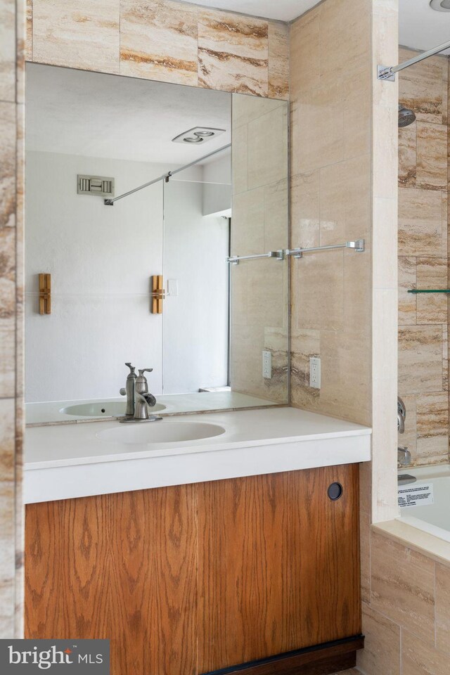 390 S Bryn Mawr Ave, Bryn Mawr, PA 19010 - full bathroom with vanity, tiled shower / bath combo, and visible vents