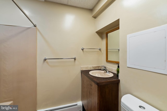 390 S Bryn Mawr Ave, Bryn Mawr, PA 19010 - bathroom with toilet, a paneled ceiling, a baseboard heating unit, and vanity