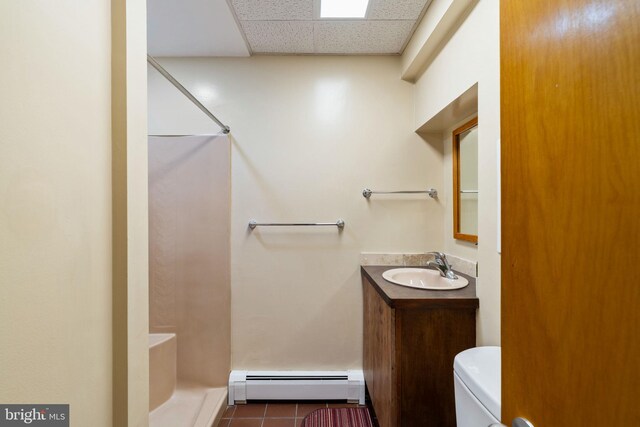 390 S Bryn Mawr Ave, Bryn Mawr, PA 19010 - bathroom featuring vanity, a baseboard heating unit, tile patterned floors, a shower, and a drop ceiling
