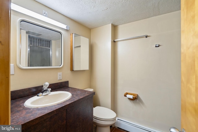 390 S Bryn Mawr Ave, Bryn Mawr, PA 19010 - bathroom featuring a baseboard radiator, vanity, a textured ceiling, and toilet
