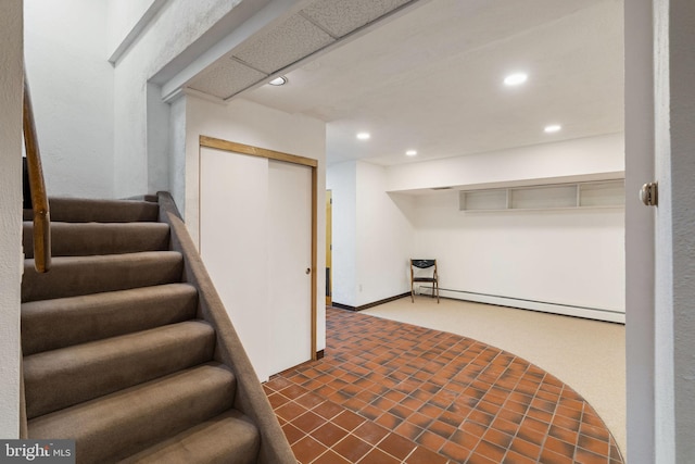 390 S Bryn Mawr Ave, Bryn Mawr, PA 19010 - finished basement with dark carpet, recessed lighting, stairs, and baseboard heating