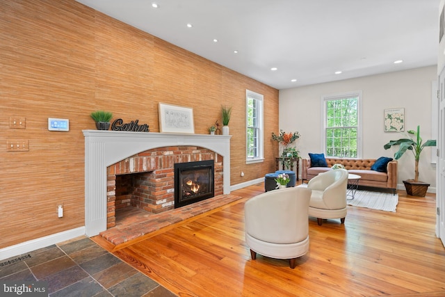 208 Biggs Purchase Ln, Lothian, MD 20711 - living room with baseboards, recessed lighting, a brick fireplace, and visible vents