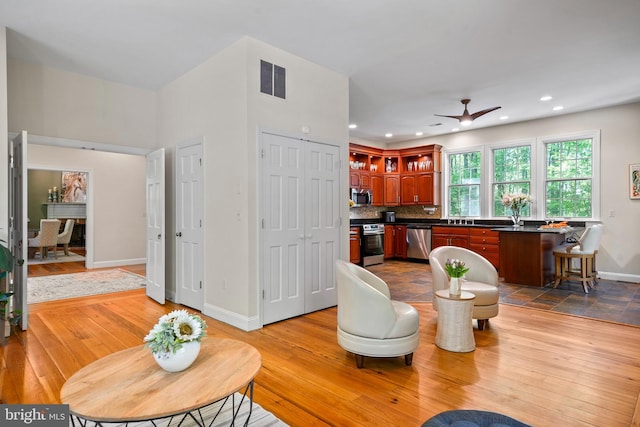 208 Biggs Purchase Ln, Lothian, MD 20711 - living area featuring visible vents, wood finished floors, baseboards, ceiling fan, and recessed lighting