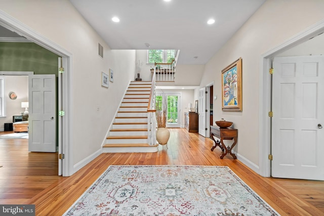 208 Biggs Purchase Ln, Lothian, MD 20711 - entrance foyer featuring visible vents, hardwood / wood-style flooring, stairs, baseboards, and recessed lighting