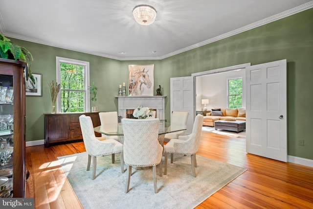 208 Biggs Purchase Ln, Lothian, MD 20711 - dining area featuring crown molding, baseboards, and wood finished floors
