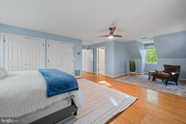 208 Biggs Purchase Ln, Lothian, MD 20711 - bedroom with a ceiling fan, visible vents, wood finished floors, baseboards, and multiple closets