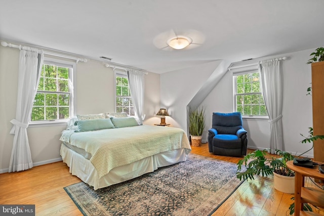 208 Biggs Purchase Ln, Lothian, MD 20711 - bedroom with baseboards, multiple windows, hardwood / wood-style flooring, and visible vents