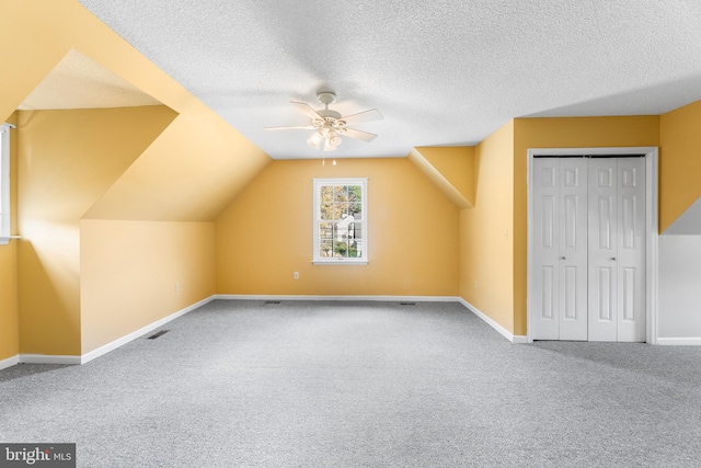 bonus room with carpet floors, ceiling fan, and baseboards