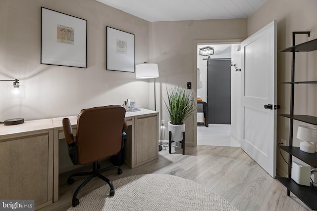 home office with light wood-type flooring