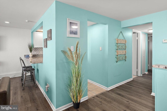 13500 Coastal Hwy Unit 201, Ocean City, MD 21842 - hallway with baseboards and wood finished floors