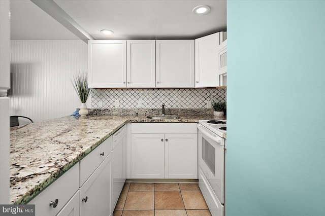 13500 Coastal Hwy Unit 201, Ocean City, MD 21842 - kitchen featuring tasteful backsplash, white cabinets, a sink, white appliances, and light stone countertops