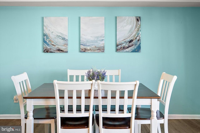13500 Coastal Hwy Unit 201, Ocean City, MD 21842 - dining room featuring baseboards and wood finished floors