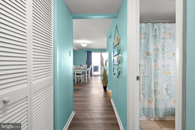 13500 Coastal Hwy Unit 201, Ocean City, MD 21842 - hallway with baseboards and wood finished floors