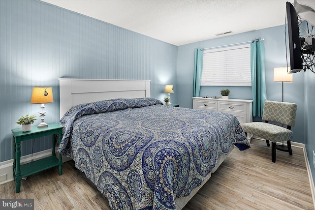 13500 Coastal Hwy Unit 201, Ocean City, MD 21842 - bedroom featuring wood finished floors and baseboards