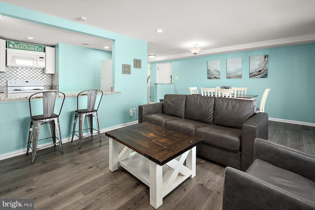 13500 Coastal Hwy Unit 201, Ocean City, MD 21842 - living room with recessed lighting, baseboards, and wood finished floors