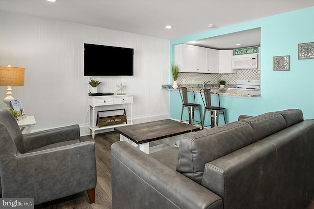 13500 Coastal Hwy Unit 201, Ocean City, MD 21842 - living area featuring baseboards, recessed lighting, and wood finished floors