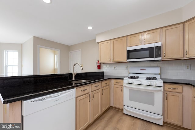 1825 Hessian Dr, Williamstown, NJ 08094 - kitchen with light brown cabinetry, white appliances, a peninsula, and a sink