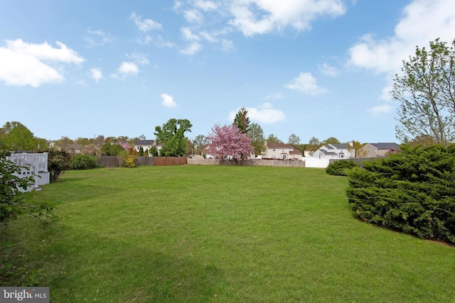 view of yard with fence and a residential view