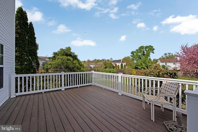 wooden terrace with a residential view