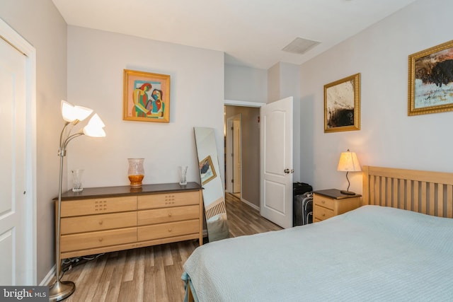 bedroom with dark wood-style floors