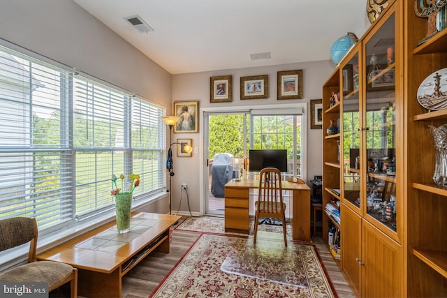 office space featuring wood finished floors and baseboards
