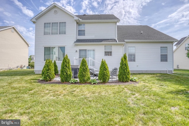 17 Fairway St, Milford, DE 19963 - rear view of house featuring a yard, a patio, and a shingled roof