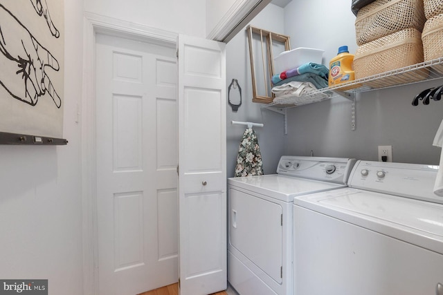 laundry room with washing machine and dryer