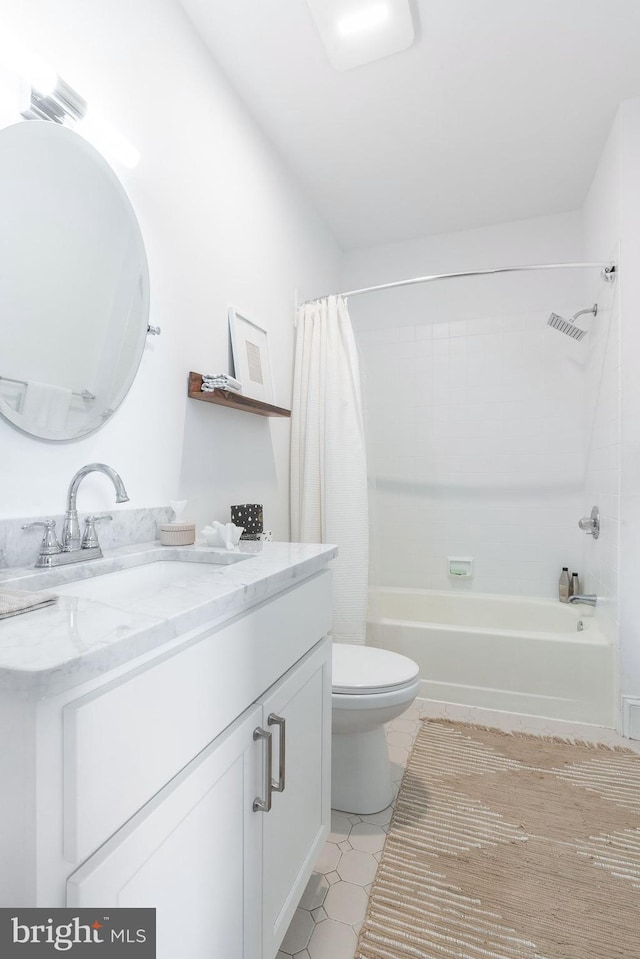 full bath with shower / tub combo, tile patterned floors, vanity, and toilet