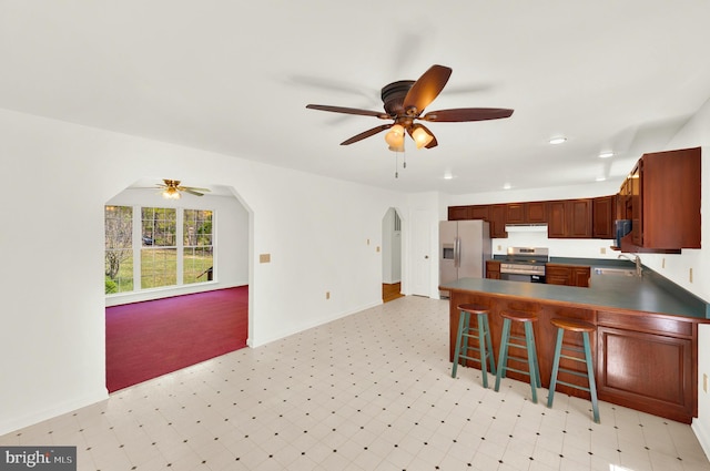 2208 Quarry Rd, Bunker Hill, WV 25413 - kitchen featuring a ceiling fan, light floors, appliances with stainless steel finishes, and under cabinet range hood