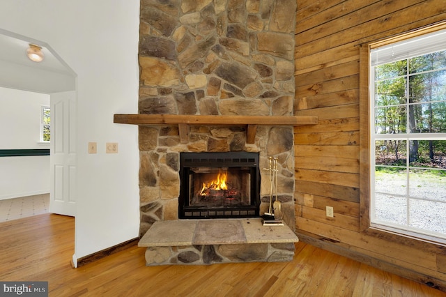 2208 Quarry Rd, Bunker Hill, WV 25413 - interior details featuring a stone fireplace, baseboards, and wood finished floors