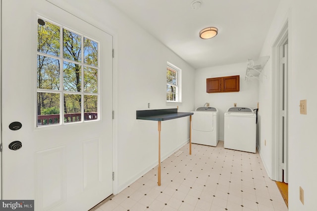 2208 Quarry Rd, Bunker Hill, WV 25413 - laundry area featuring cabinet space, separate washer and dryer, baseboards, and light floors