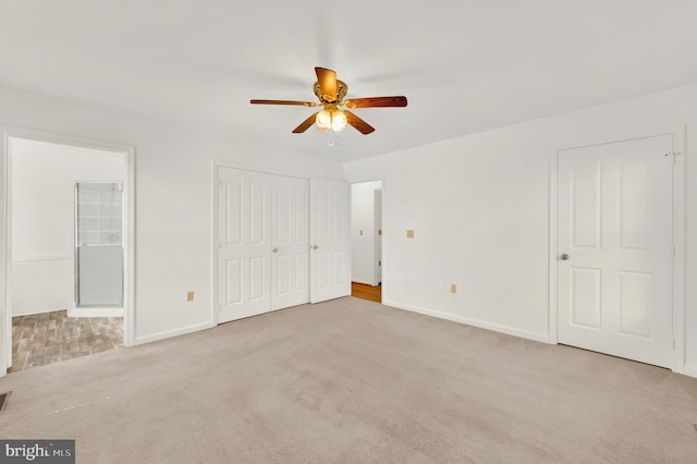 2208 Quarry Rd, Bunker Hill, WV 25413 - unfurnished bedroom with baseboards, carpet flooring, ensuite bathroom, and a ceiling fan