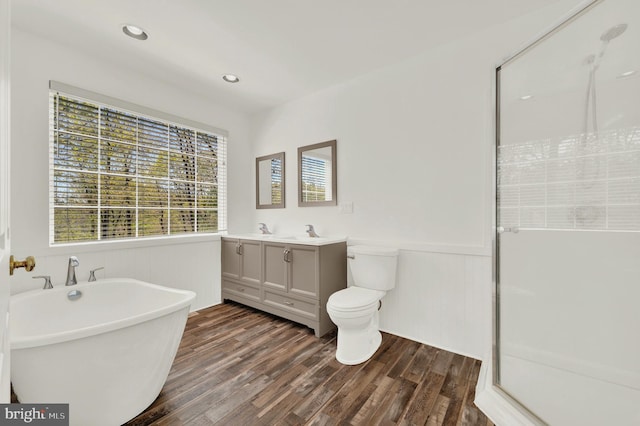 2208 Quarry Rd, Bunker Hill, WV 25413 - bathroom featuring vanity, wainscoting, a stall shower, and wood finished floors