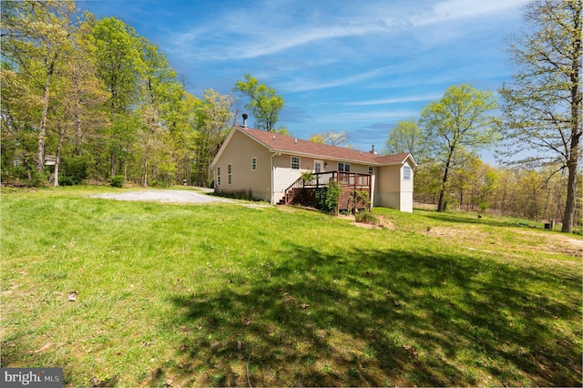 2208 Quarry Rd, Bunker Hill, WV 25413 - rear view of house featuring a lawn, stairway, and a deck