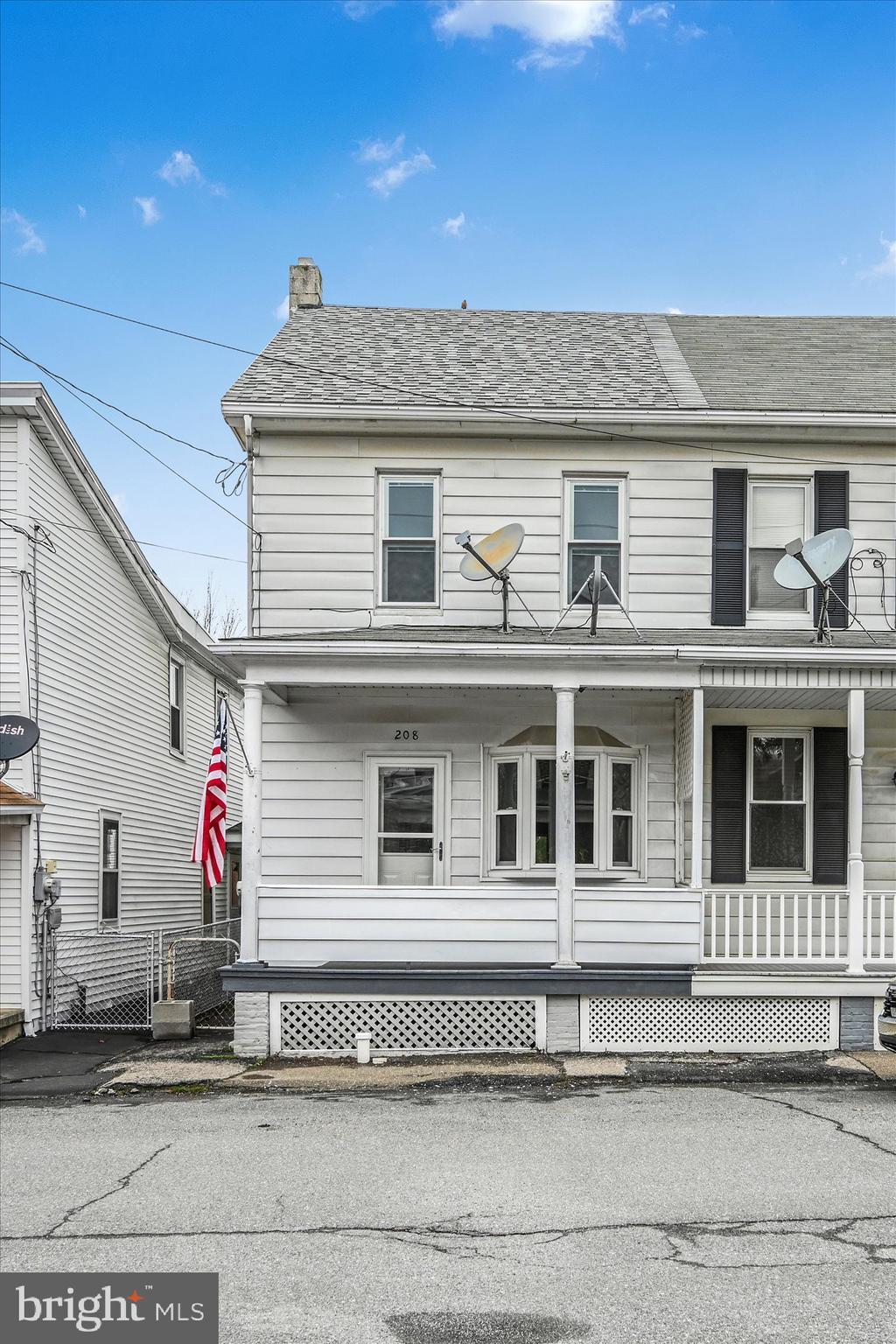 208 Green St, Brockton, PA 17925 - view of front of home featuring roof with shingles, a chimney, and covered porch
