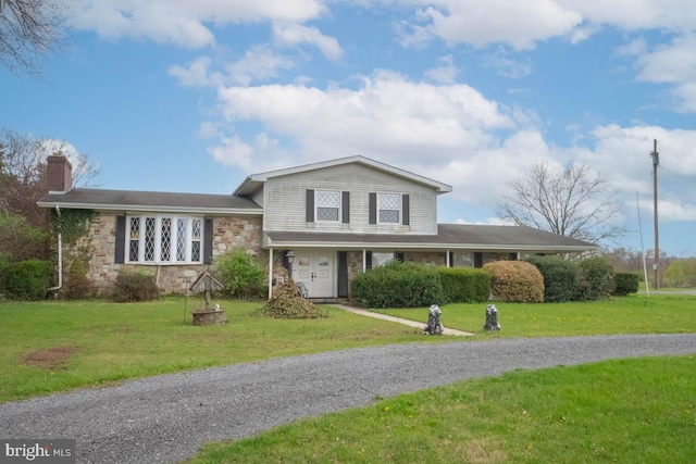 10905 Keysville Rd, Emmitsburg, MD 21727 - split level home featuring a chimney, a front lawn, stone siding, and an attached garage