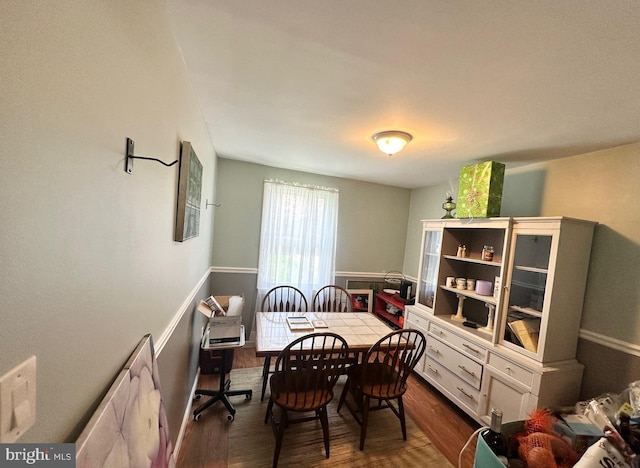 dining area featuring dark wood finished floors