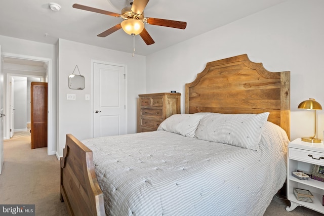 bedroom with baseboards, light colored carpet, and ceiling fan